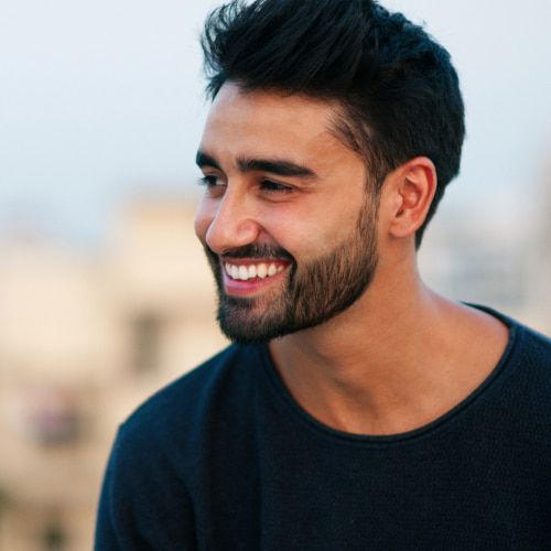 A man smiling happily